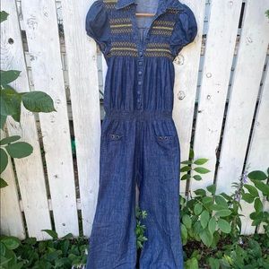 Vintage denim jumpsuit with cap sleeves and smocking. Cute as a button sz M